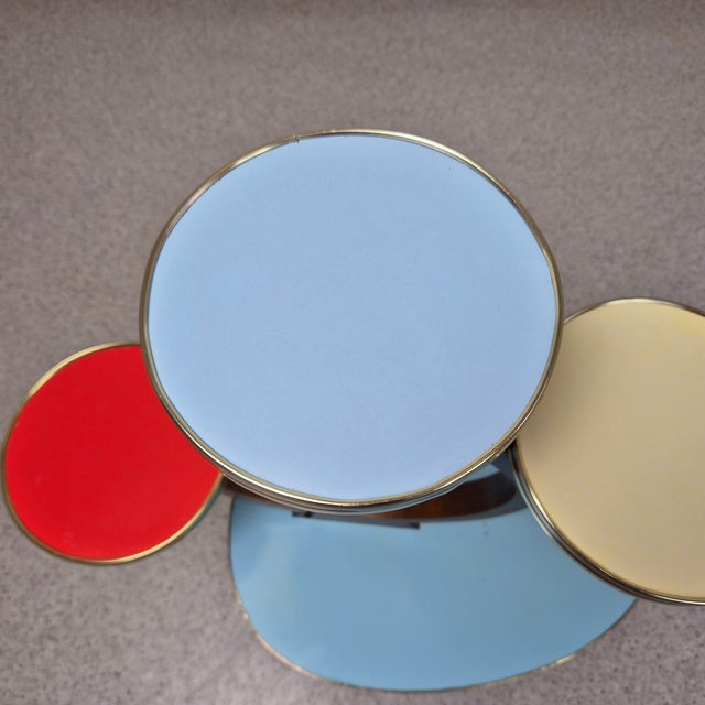 1960s Rockabilly Flower Stand Dimensions: H 75 cm | Shelves 42 × 30 cm, 17 cm round A vibrant 1960s flower stand in...