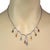 This is a stunning dangle gems collar necklace, it is crafted from 14k white gold featuring the front center of the...