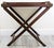 A handsome richly stained mahogany vintage Butler's Tray Table that sits on a folding stand, circa Mid 20th Century. This...