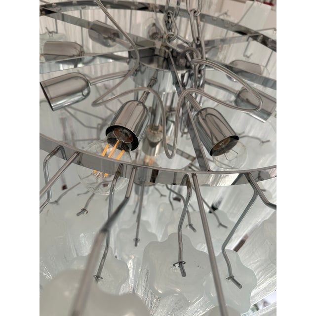 Contemporary italian Chandelier With transparent venied-white “tronchi ” Murano Glass . This round chandelier showcases a...
