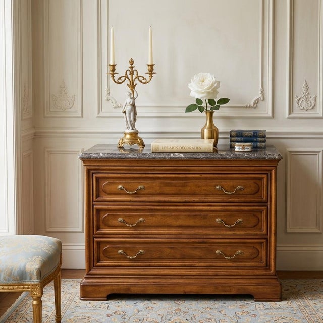 A vintage Henredon French Provincial 3-drawer commode chest with Italian marble top. Crafted in a warm fruitwood finish,...