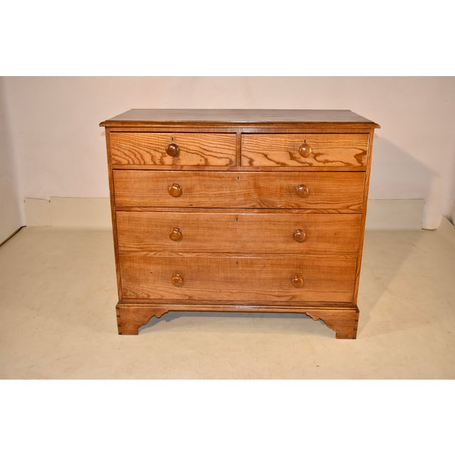19th century chest of drawers from England, made from Hungarian Ash wood. The wood gives the entire piece almost a glowing...