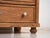 This solid pine chest of drawers is a rustic European storage piece from the early 20th century, originally used as a...