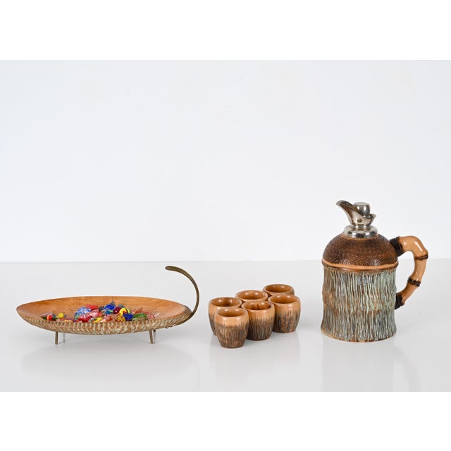 Beautiful bar set in carved wood and brass. This lovely set was designed by Aldo Tura and produced by Macabo in Milano,...