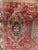 Antique wool rug with geometric patterns on a red background Used condition, see photos Dimensions: 180 x 98 cm 20th century