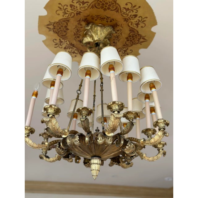 Introducing our exquisite French-inspired chandelier crafted from beautiful warm brass salvaged from the Pacific Palisades...