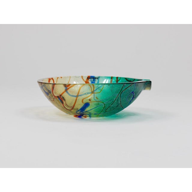 A colorful and decorative Murano art glass bowl from the 1970s by Alfredo Barbini, Venice, Italy. Originally designed as...