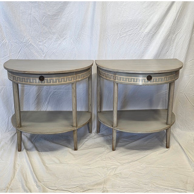 A beautiful pair of pine single drawer demi-lune tables which have been handpainted in the antique Gustavian Swedish style...