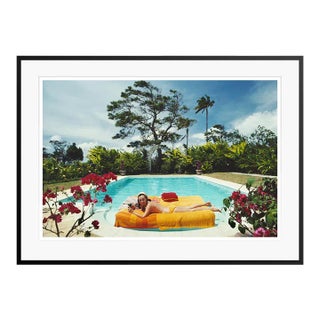 Sunbathing in Barbados 1976 by Slim Aarons Black Framed C-Print For Sale
