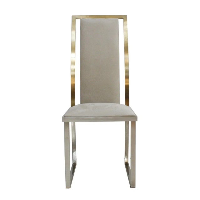 Michel Mangematin set of eight chairs made of steel and brass, upholstered in grey velvet, France, 1970s. This piece is...