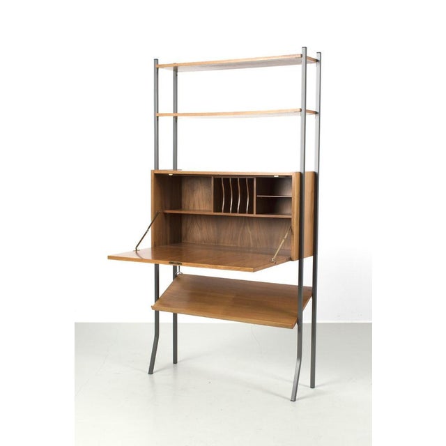 Beautiful Freestanding Modular Cabinet. The Cabinet is made of teak veneer with metal legs. Has 3 shelves and one cabinet...