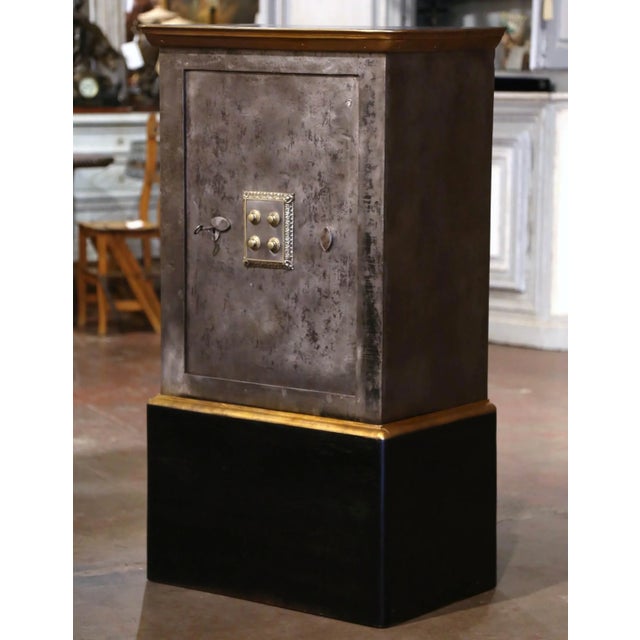 This antique wooden and iron safe, was crafted in Paris, France, circa 1870. The black painted and polished iron safe...