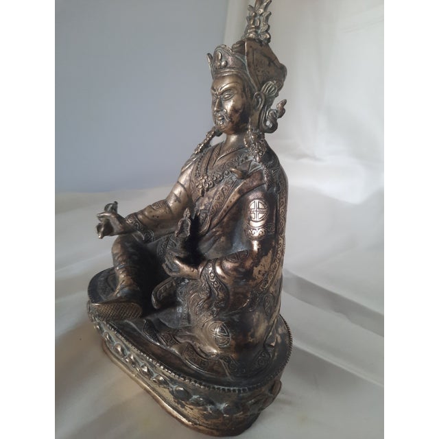 Add a striking piece of traditional Asian artistry and symbolism to your collection with this finely cast bronze sculpture...