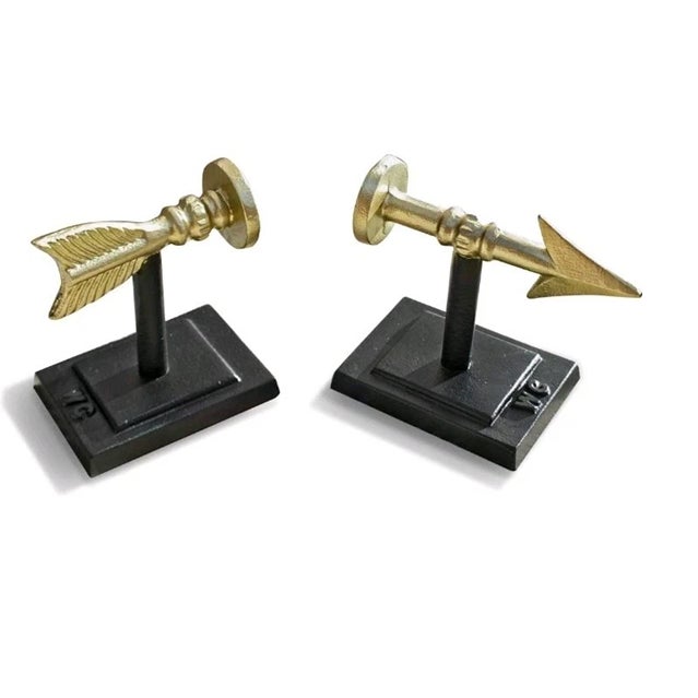 Add a bold Mid-Century accent to your bookshelf with this striking pair of Vintage Cast Iron Metal Arrow Bookends....