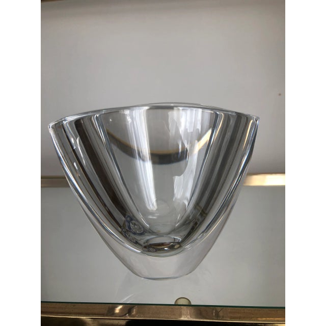 Signed Modern Orrefors crystal heavy vase. With a thick and heavy mirror lip and organic lines that give a spectrum...