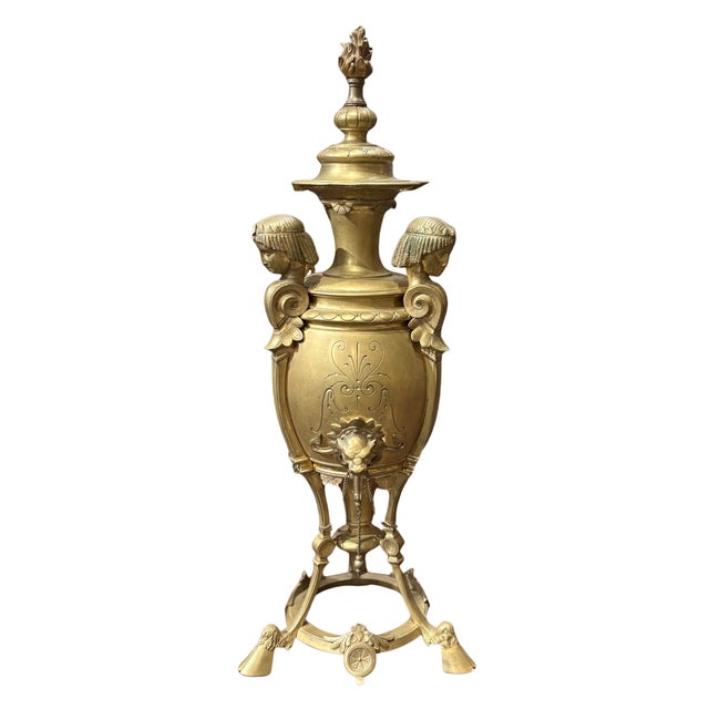 A fine pair of French Nineteenth Century Renaissance Revival Urns, circa 1870. The urns each are capped with flame finials...