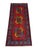 This tribal Oriental runner features three colorful Filpa, or elephant foot, medallions set along a vivid red field. Slate...