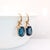 Contemporary 16ct Solitaire London Blue Topaz Earrings in Solid 14K Yellow Gold | OV 14x10mm For Sale - Image 3 of 4