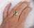 Colombian Emerald and Diamond 5 Stone Platinum Ring. This dainty ring is crafted from platinum 900. It features a...