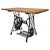 A distinctive vintage 20th-century table, combining an original Singer sewing machine base with a substantial wooden top...