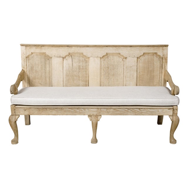 English 19th Century Oak Bench with Carved Back, Downswept Arms and Cushion For Sale