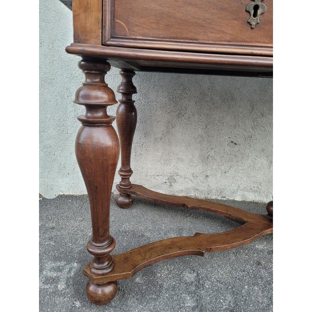 Beautiful large 17th century walnut table from a palace in Genoa, Italy. The 2 drawers at the front are delicately inlaid;...