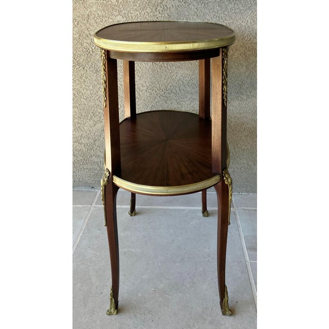 1930s Circa 1930 Louis XVI-Style Mahogany Starburst Marquetry Two-Tier Oval Accent Table With Brass Mounts For Sale - Image 5 of 18