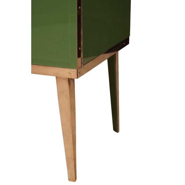 Two-door bar cabinet handcrafted in Italy by Justfurnituress, with a birch wood structure, green glass panels and polished...
