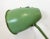 This green industrial style iron table lamp was made in former Czechoslovakia. It features an iron shade ,base and arm,...
