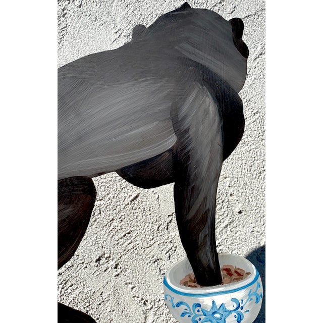 Tole monkey with Chinese export bowl towel rack, realistically painted with the monkey reaching into the bowl. Painted...