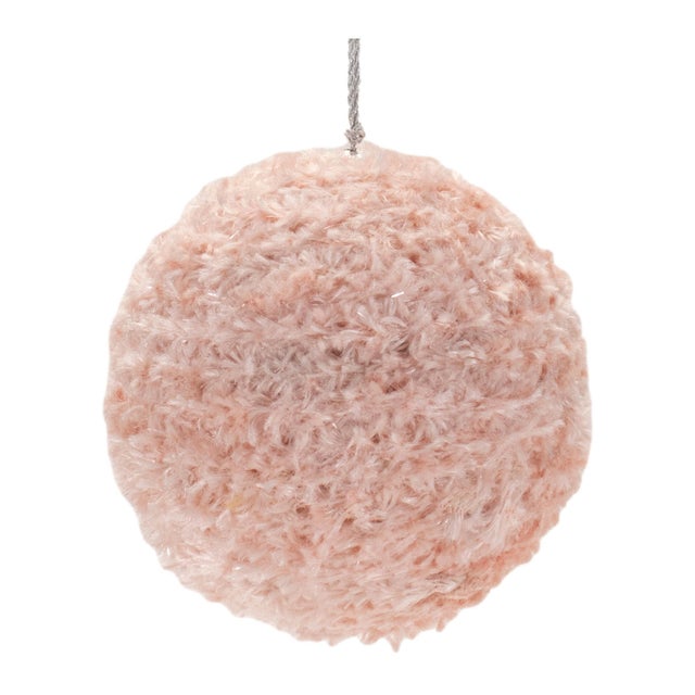Add a playful yet glamorous touch to your holiday decor with this set of 4 Furry Ball Ornaments. Crafted in soft pink...