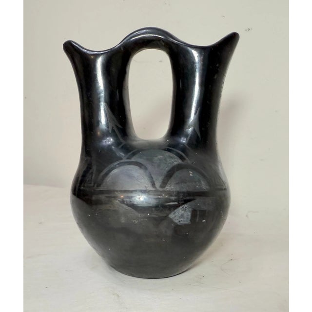 Up for sale is a nice quality vintage handmade Santa Clara Native American Pueblo pottery wedding bowl done by artists...