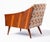 Unique Mid Century Lounge Chair with solid walnut arms and legs and walnut veneer sides. This chair is of unknown origin...