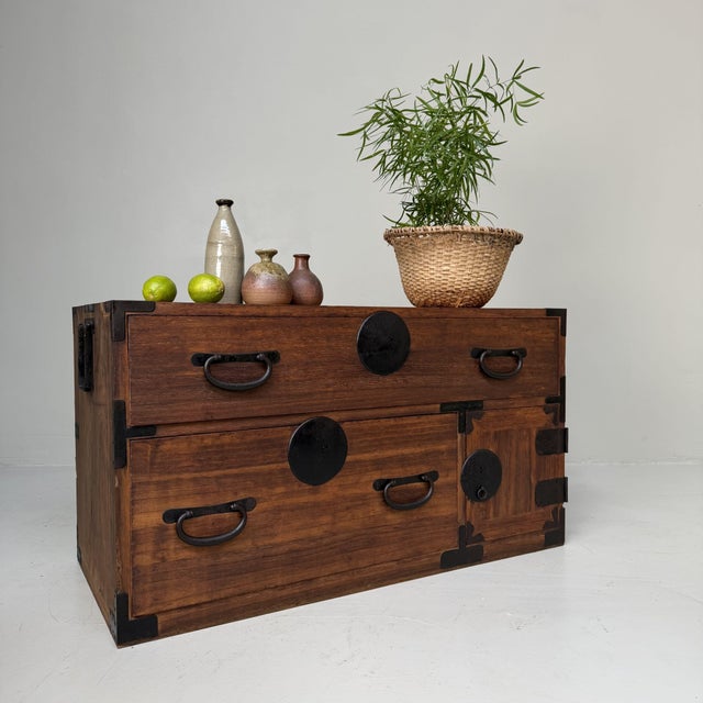 Low Japanese chest of drawers with a strong, understated presence and a beautiful balance between functionality and...