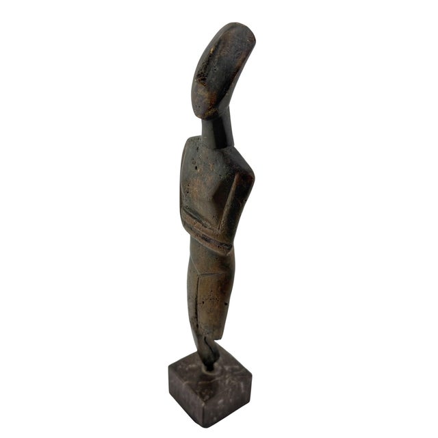 Cycladic Revival Bronze Figure on Marble Base, European, circa 1950s This restrained bronze figure is a mid-20th-century...