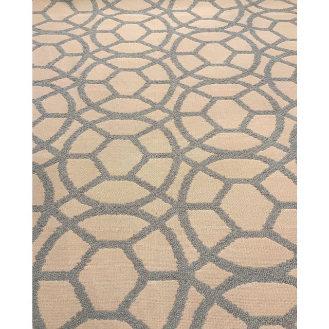 This modern geometric pattern is a cut light blue chenille on a beige woven base cloth. It’s hand is soft and it is...