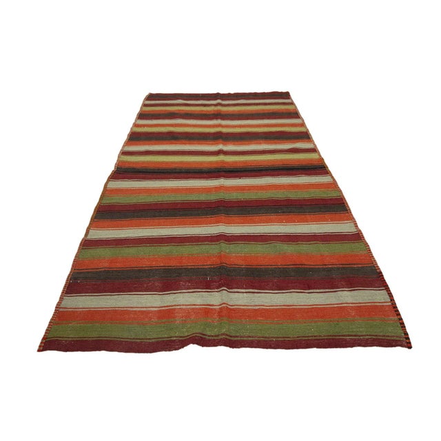 Handwoven vintage kilim rug from Denizli region of Turkey.Approximately 45-55 years old. In good condition.