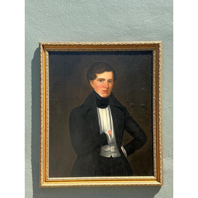 This vintage oil portrait captures a classical gentleman with poised, contemplative presence, skillfully rendered on...