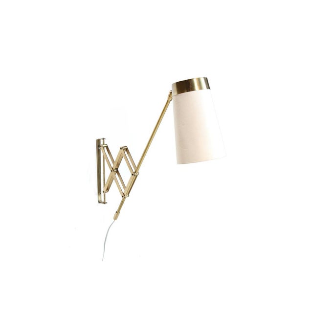 Beautiful, rare brass wall lamp by T.H. Valentiner from Denmark. Thanks to the cleverly designed scissor mechanism, the...