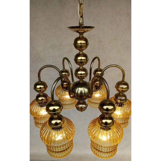 Nice authentic retro vintage chandelier, golden color holder with patina, 6 light elements made of yellow notched glass,...