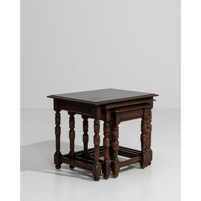 A sophisticated set of three French nesting tables from circa 1970 exemplifies the clean, understated elegance that...