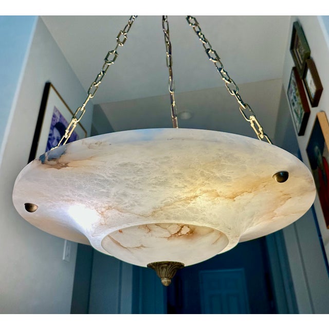 Large alabaster pendant light or chandelier with aged patinated brass fittings in the Directoire style. The white...