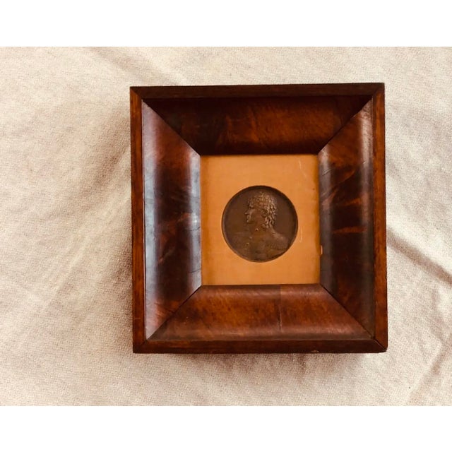 --- # DESCRIPTION Hold one of these and history has weight — literally. Heavy cast bronze, portraits modeled by hands that...