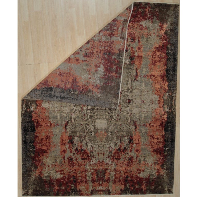 Hand-knotted in wool, this 8 x 10 Isla Sumptuous rug carpet is a refined addition to our contemporary room-size rug...