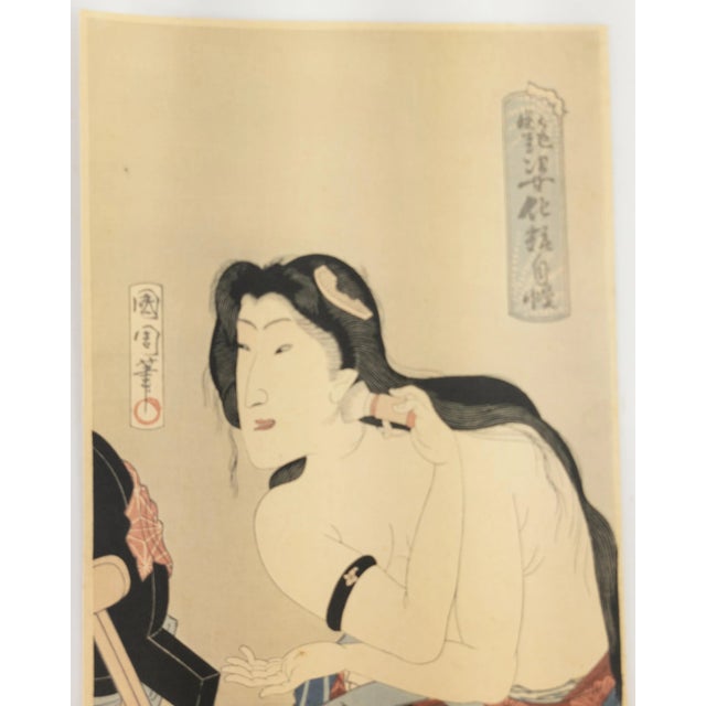 We are selling this Japanese woodblock Ukiyo-e print of a woman applying makeup, attributed to Kitagawa Utamaro....