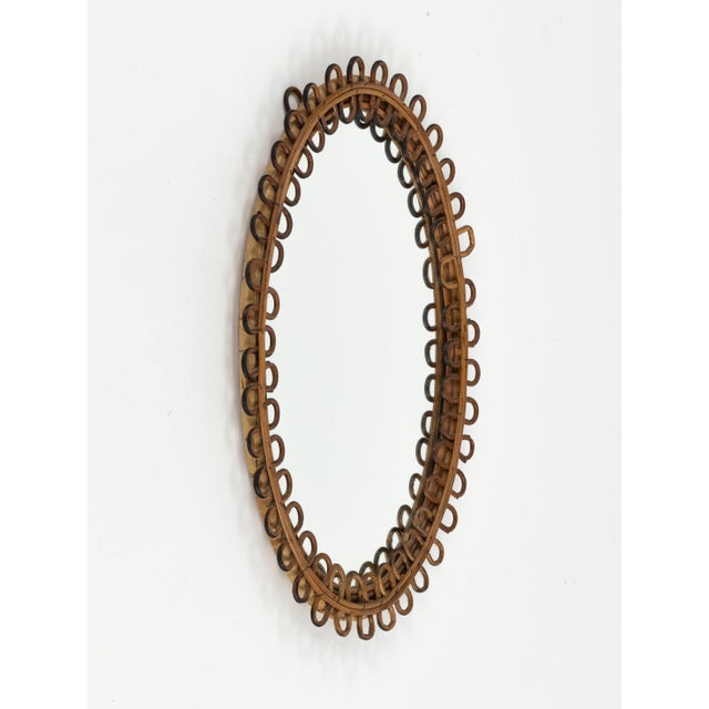 Midcentury beautiful oval wall mirror in bamboo and rattan in the style of Franco Albini. Made in Italy in the 1960s. A...
