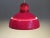 Red plastic suspension produced by osram germany. the lamp is equipped with a white plastic light distributor and a...