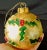 Beautiful set of four large vintage gold foil shmmer glass ornaments with hand painted red & green mistletoe. They are...
