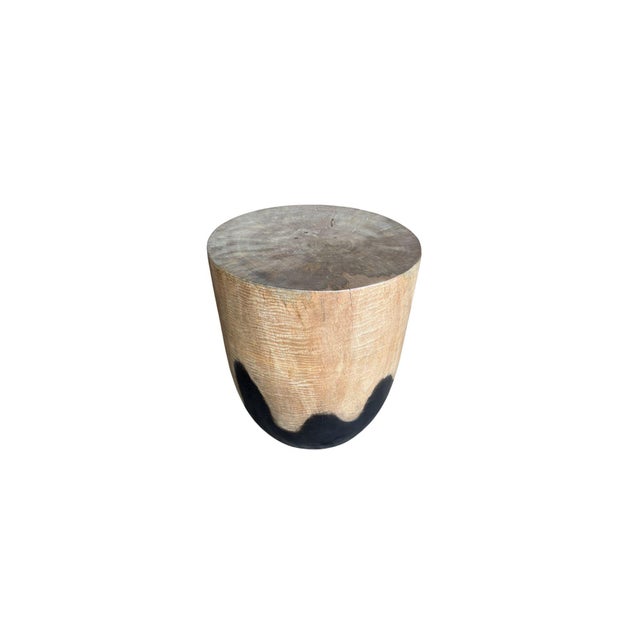 Elevate your space with this striking round mango wood side table, crafted to showcase the natural beauty and unique...