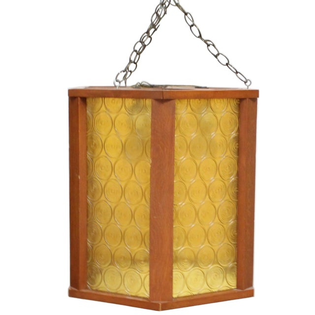 This Large Mid-Century Modern lantern features a classic Mediterranean or Spanish Revival aesthetic. This pendant light is...